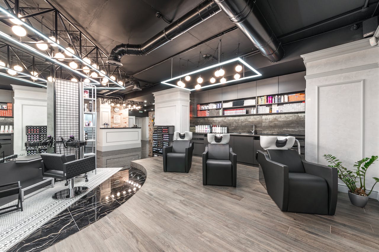 Services Contemporary hair salon interior showcasing modern decor and styling equipment.